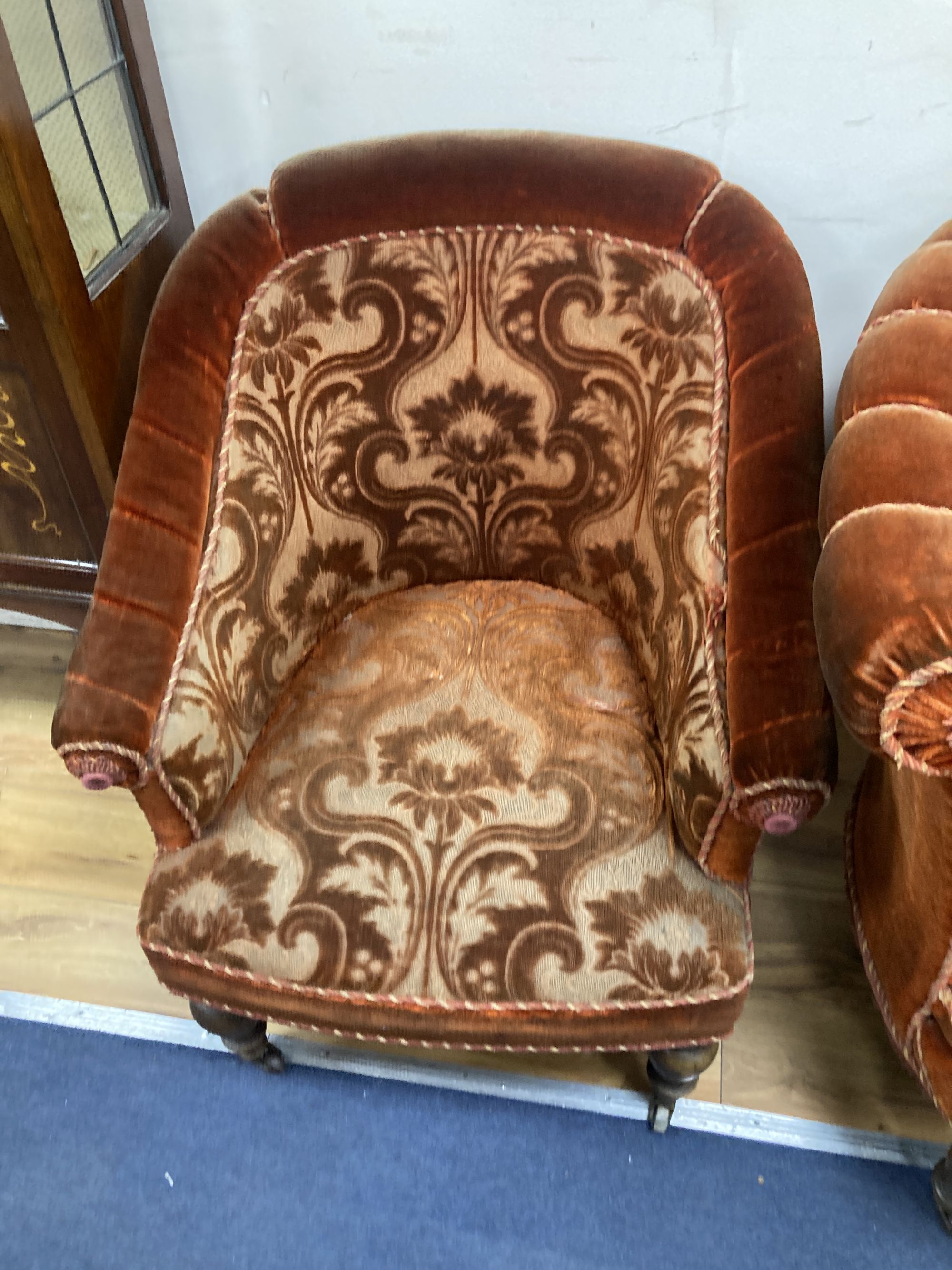 A small Victorian chaise longue, length 120cm, depth 80cm, height 84cm and matching tub framed armchair, each with cut red velvet uphol